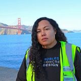 Kimberley Robles standing in front of the Golden Gate Bridge