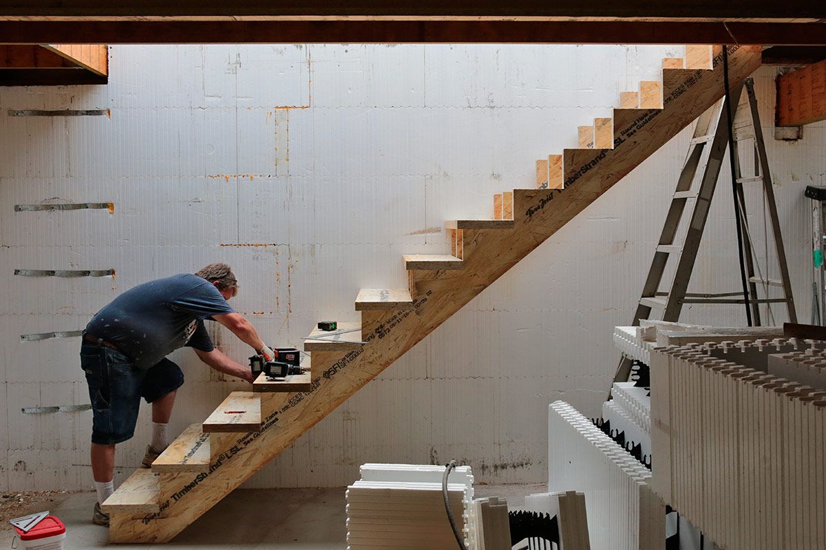 The same LSL rim boards used around the perimeter of the I-joist floor framing are also put to work as stair stringers and treads, where their consistency, length, strength, extra depth and straightness make this work faster, easier and far more accurate.