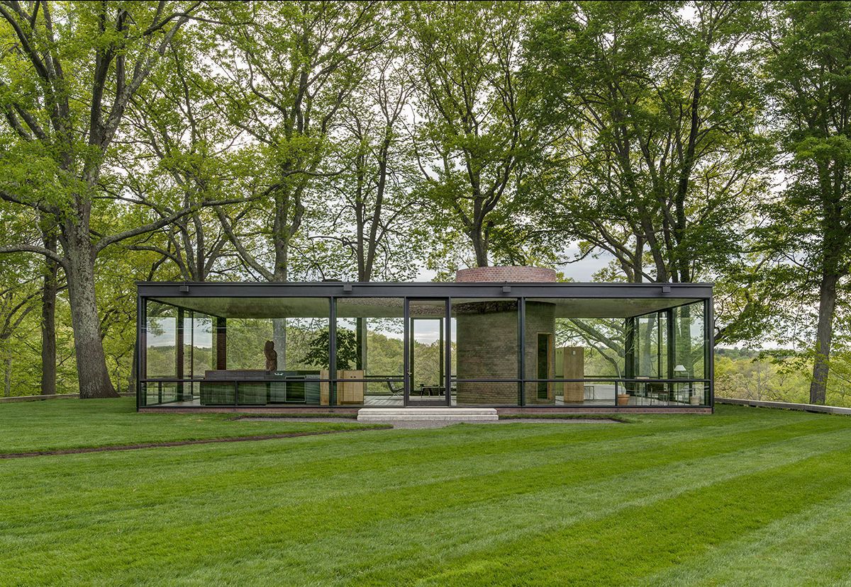 Glass House by Michael Biondo Set amidst 49 pastoral acres in New Canaan, Conn., Philip Johnson's Glass House (1949) is a National Trust Historic Site famed for its minimalist use of industrial materials, particularly steel, glass, and concrete. Note the characteristic low-slung roof and sleek lines of the structure. The large expanses of glass are repeated in the landscape’s swaths of green, which work to visually tie the house to its site. Photo by Michael Biondo.