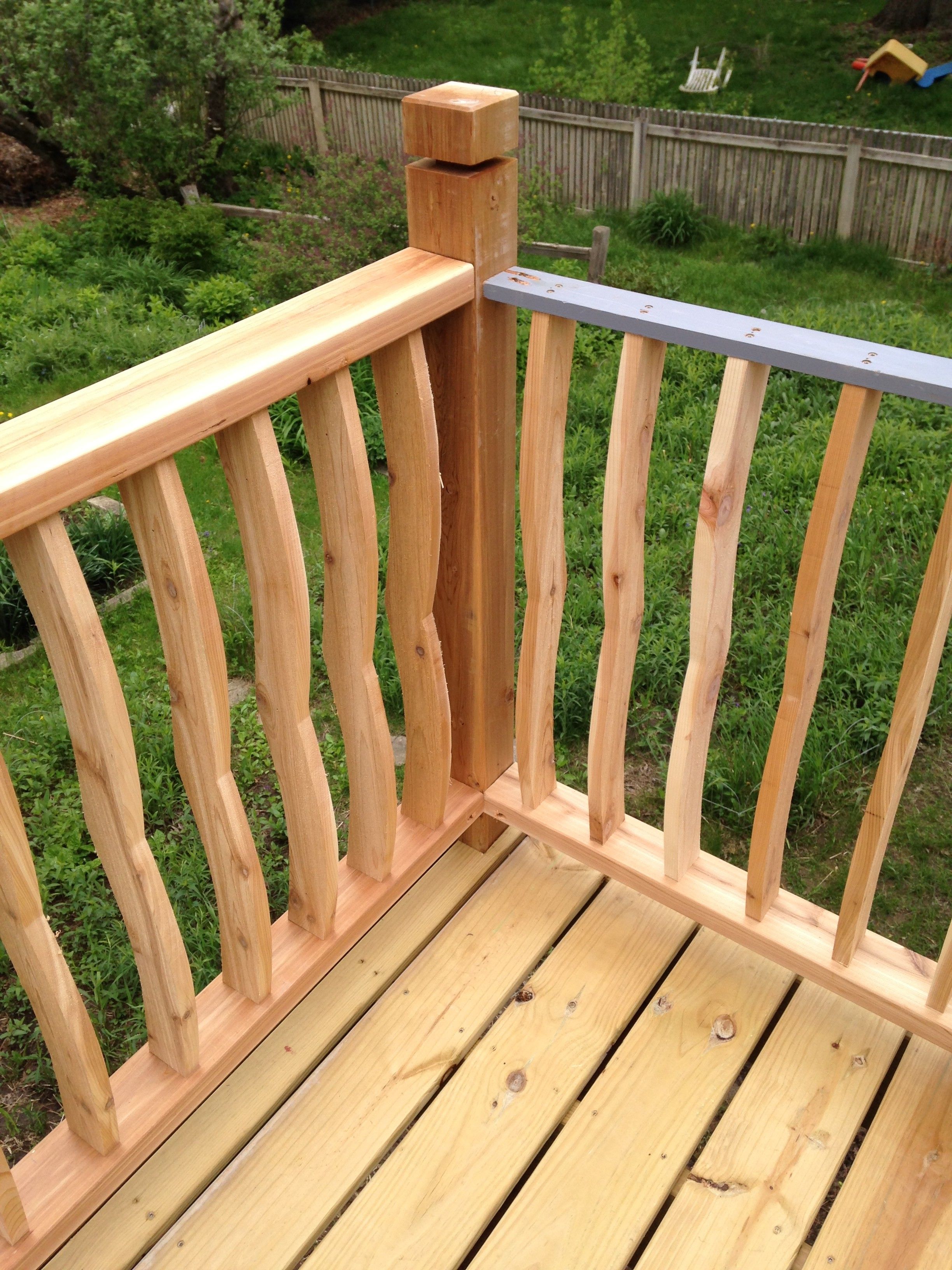Curved ballisters and no visible fasteners top rail - Fine Homebuilding