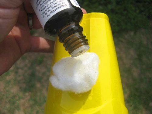 dripping some essential oil onto a cotton ball