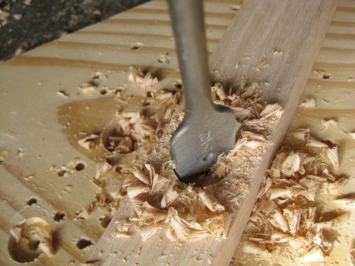 when drilling the hole through the furring strip, put a piece of scrap board lumber under it.