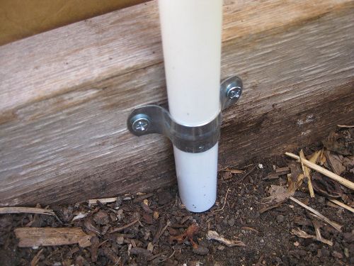 The metal pipe clamp holds the PVC pipe in place, and prevents it from moving around in the ground.