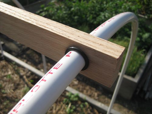 The two rubber o-rings secure the "hoop connector bar" to the PVC pipes