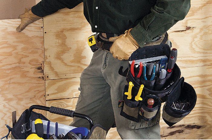 Tool belt of carpenter working on the framing process of home construction  in Southern California Stock Photo