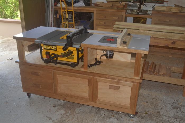 Woodworking chisels and saws on a old work table. Well used