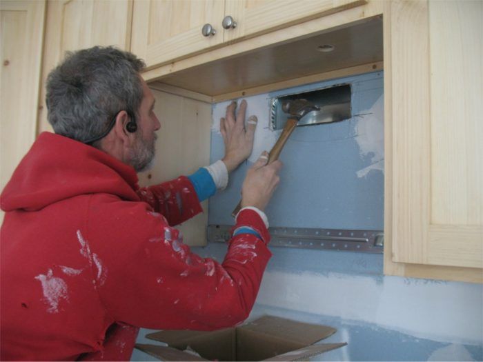 Why is cold air coming down my range hood vent?