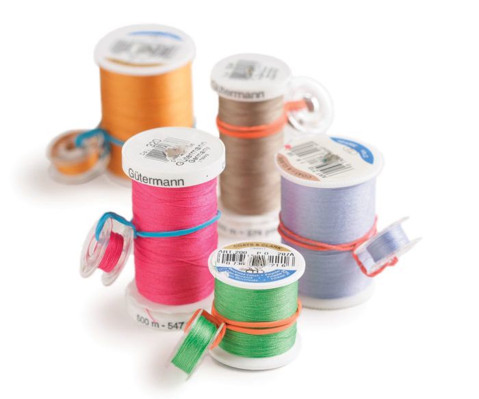 Spools of Thread, Bobbins with Threads of Different Colors and