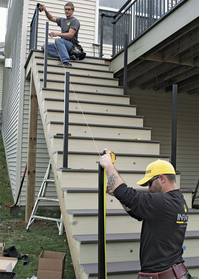 19. Mark posts for trimming. Measure so the handrail is 34 in. to 38 in. from the nose of the tread. Using the same measurement at the top and bottom of the run, snap a chalkline to mark the angle for cutting each post.