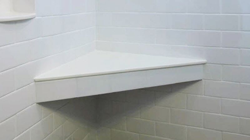 Corner shelves with subway tile in shower and white grout.  Shower corner  shelf, Amazing bathrooms, Bathroom corner shelf