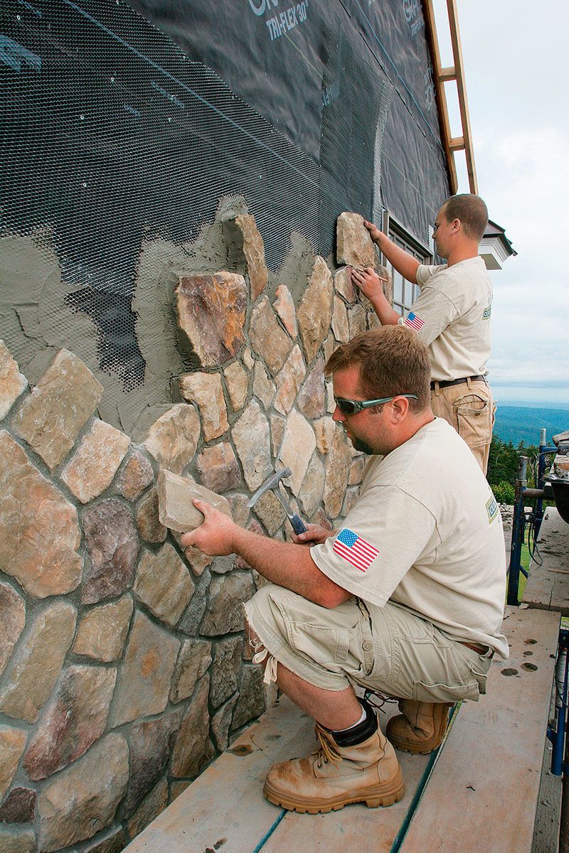 faux stone being put on