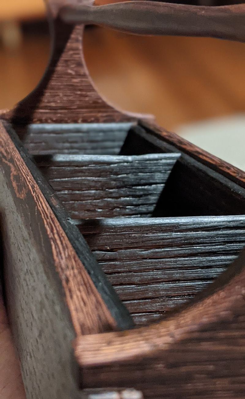 close up of textured wood on tea caddy